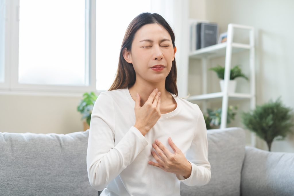 Woman suffering from acid reflux