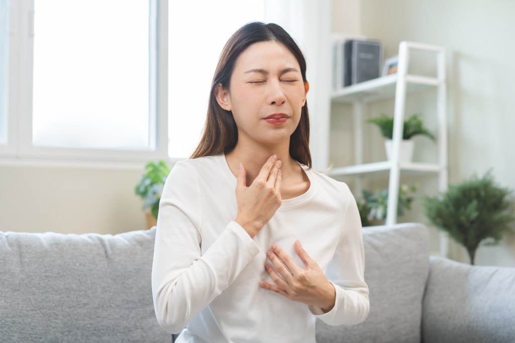 Woman suffering from acid reflux