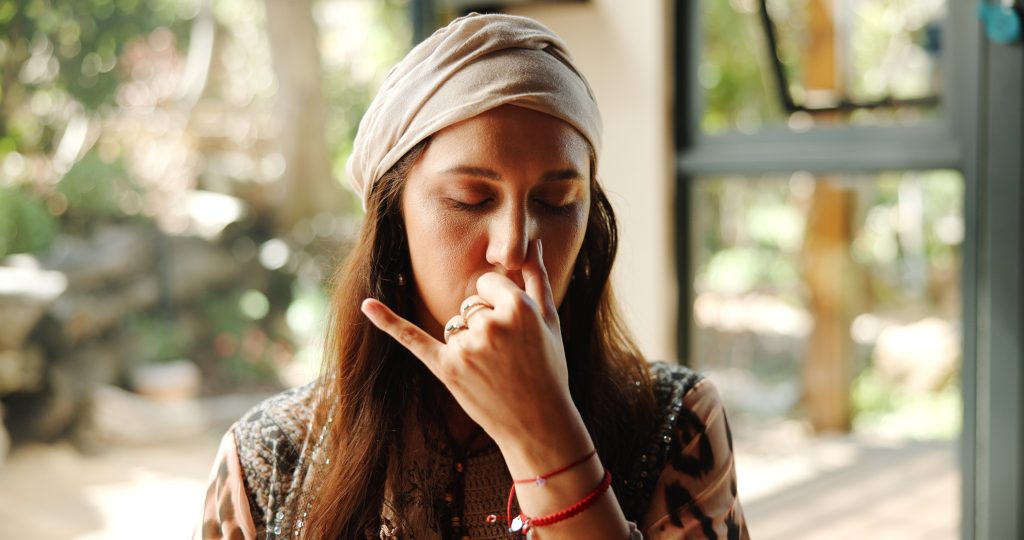 Women performing alternate nostril breathing