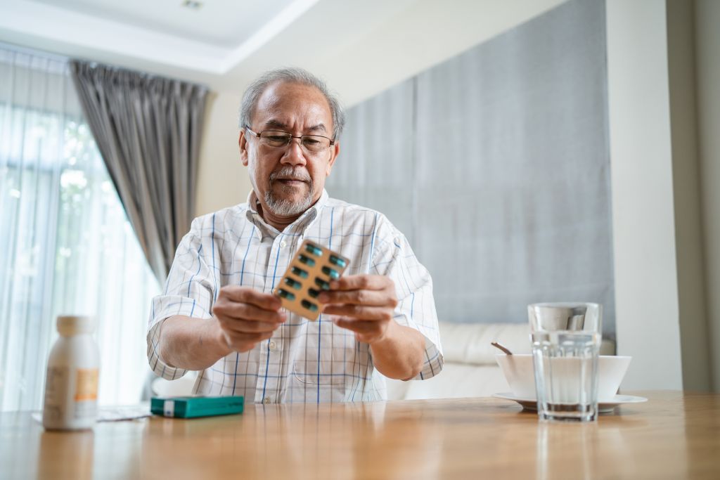 Man reading drug label  
