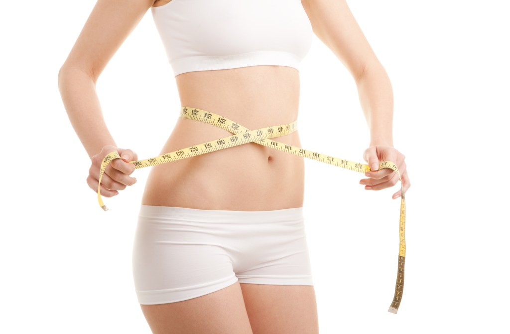 Female ectomorph with measuring tape