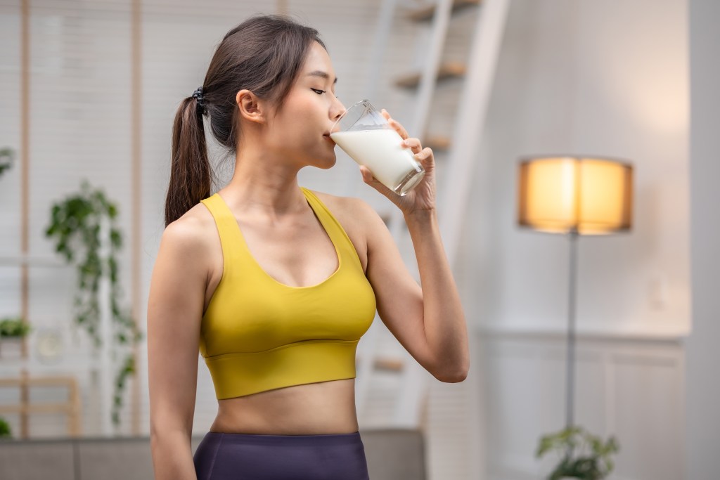 Woman drinking milk after a workout