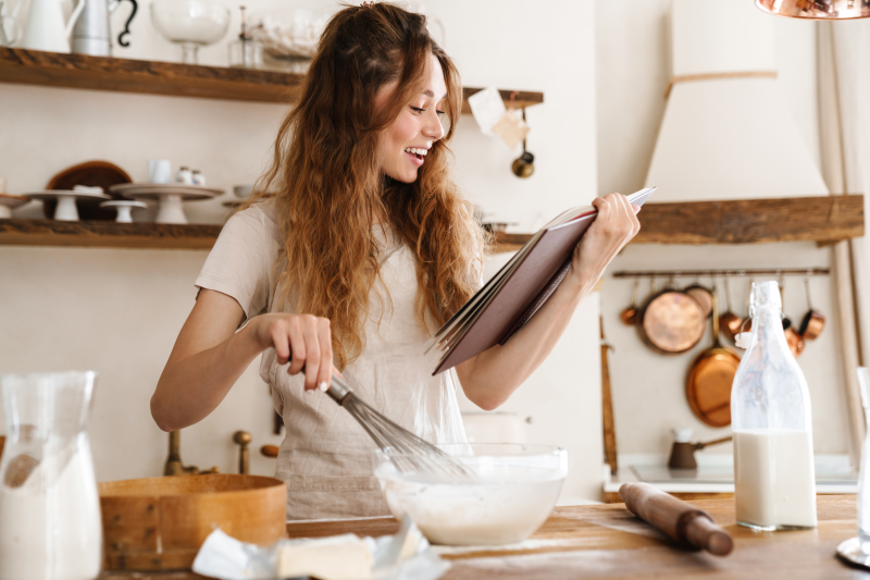 Healthy young women reading a recipe