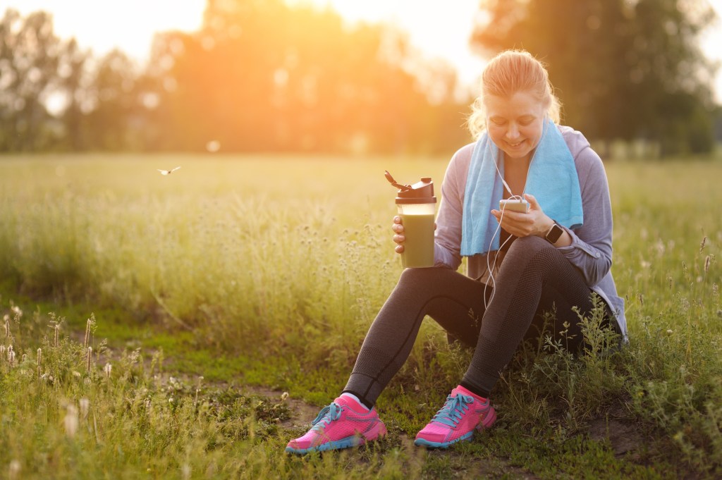 Woman drinking a sports smoothie