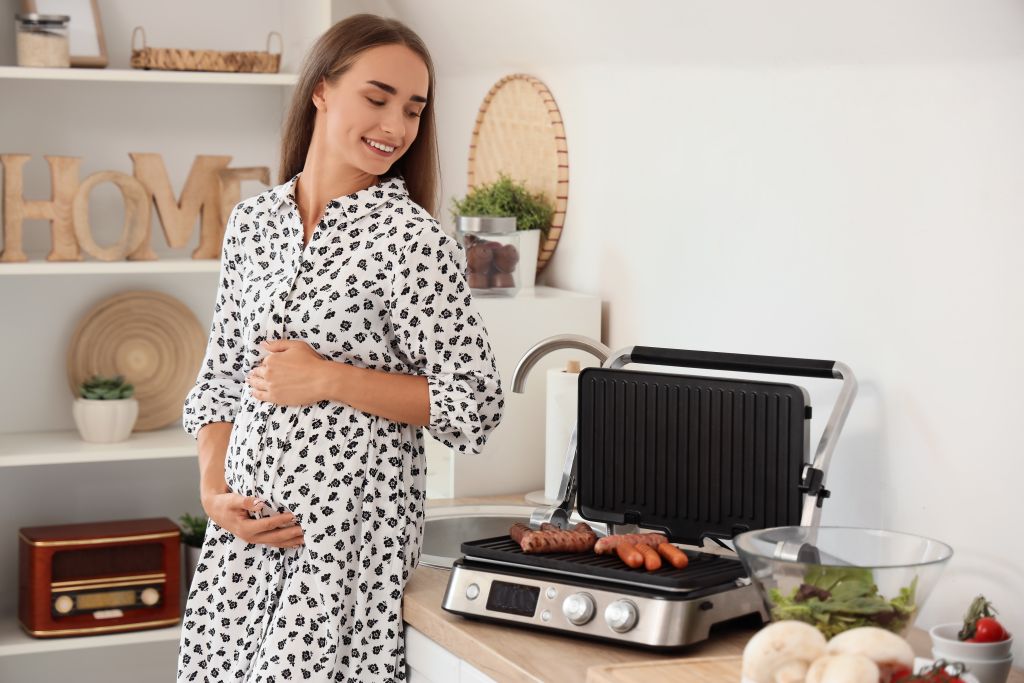 Pregnant woman cooking 