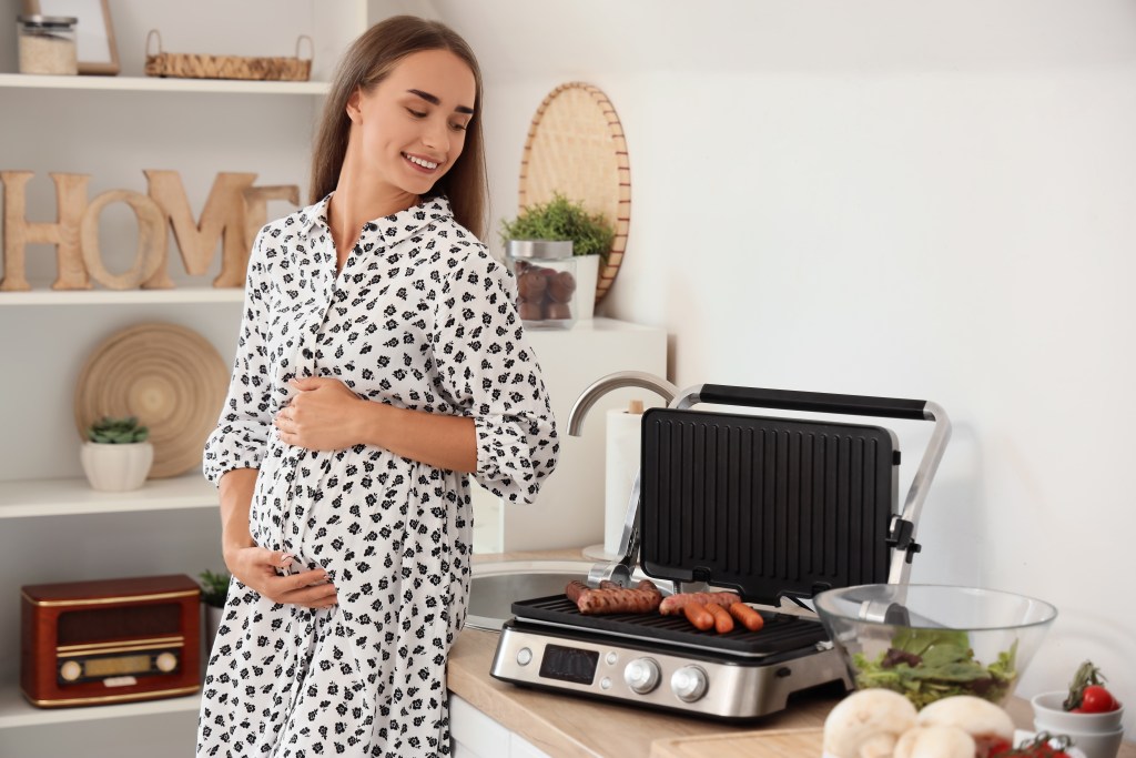 Pregnant woman cooking