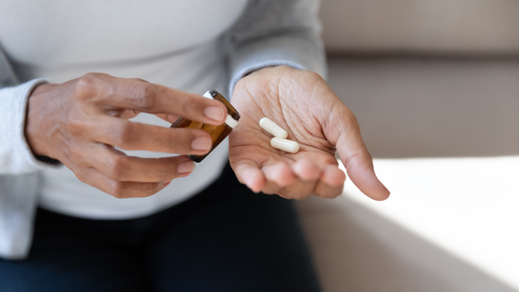 Woman holding a supplement