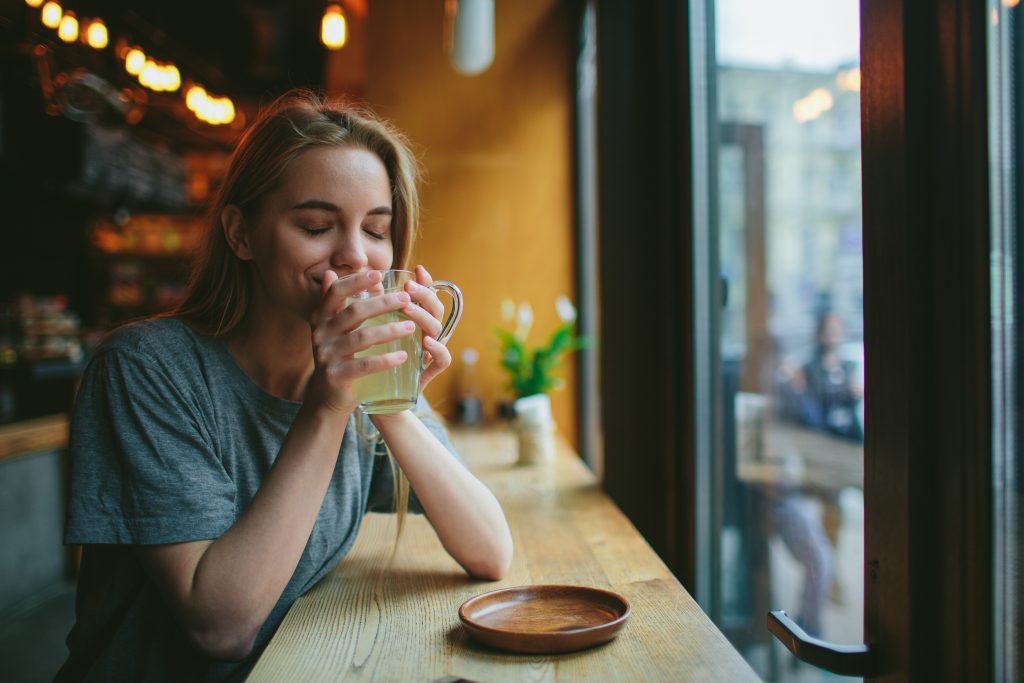 Woman drinking hot tea 