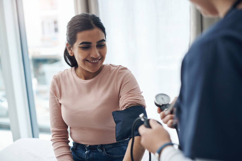 Doctor checking blood pressure