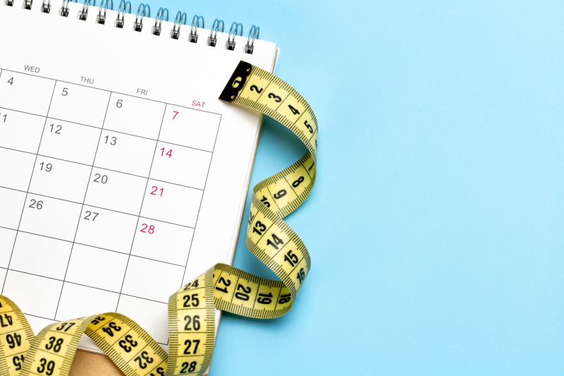 Calendar with measuring tape for weight loss planning