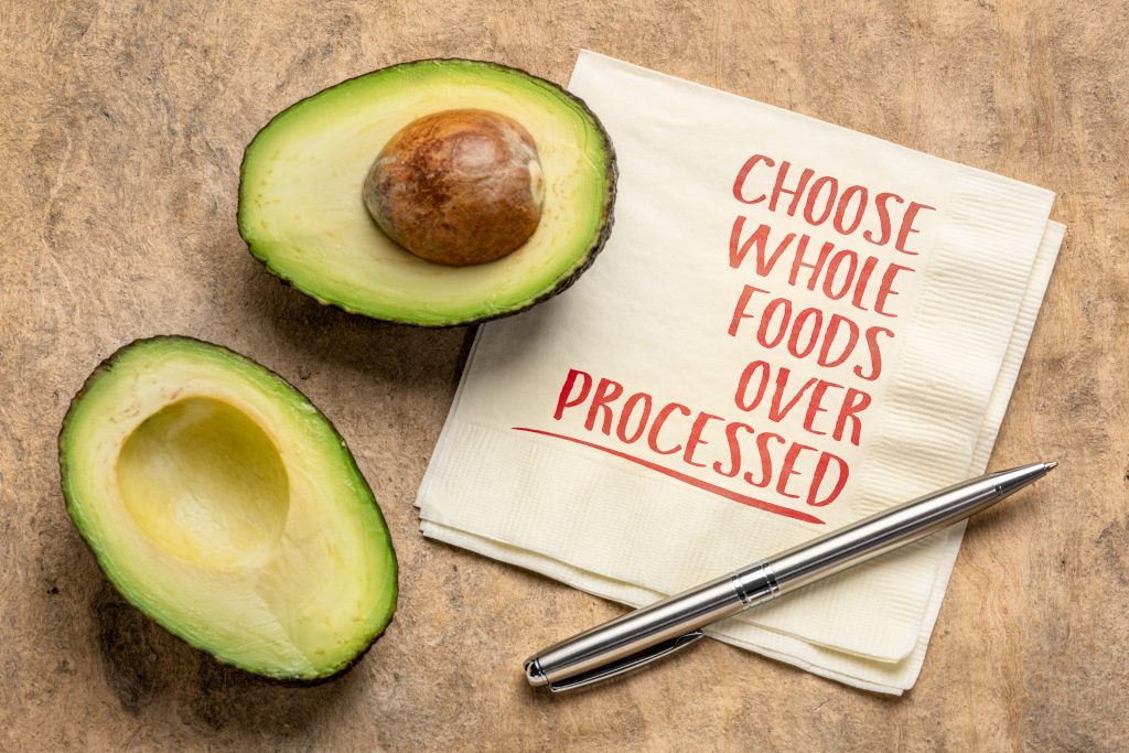 Sign stating choose whole foods over processed