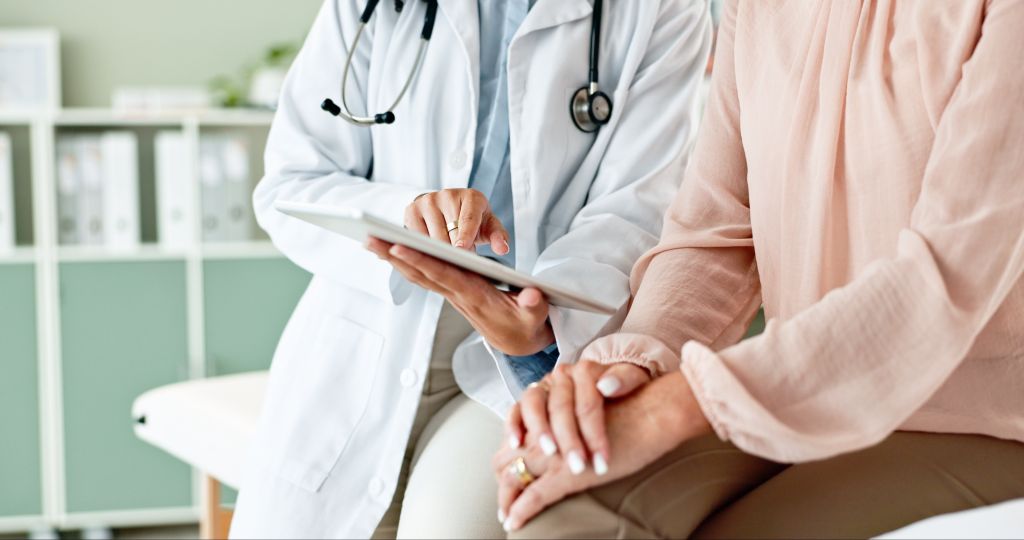 Woman talking to doctor