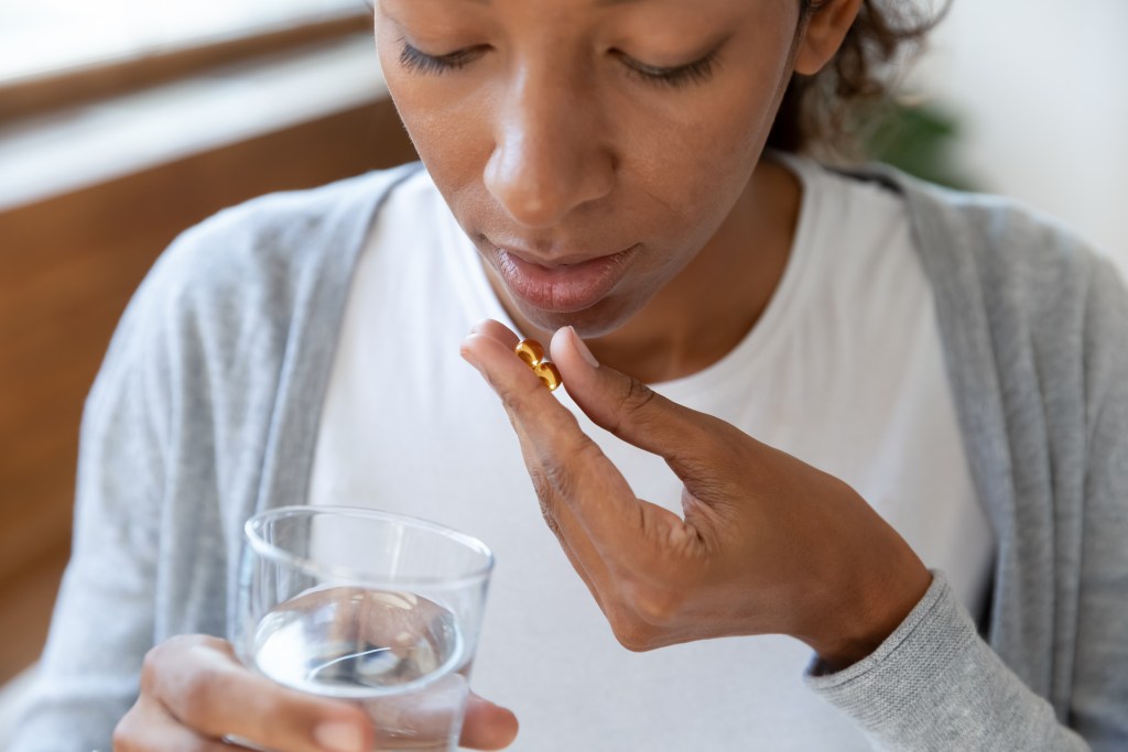 woman taking supplements 