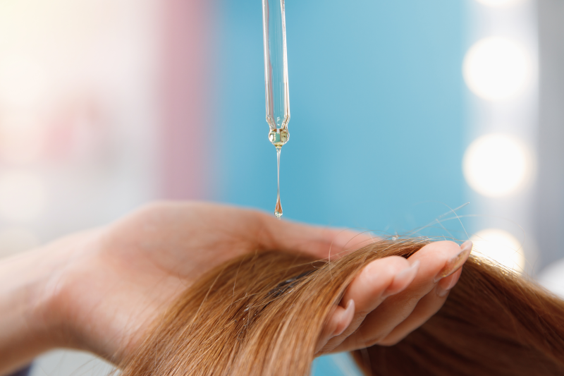 Applying healthy oil to hair