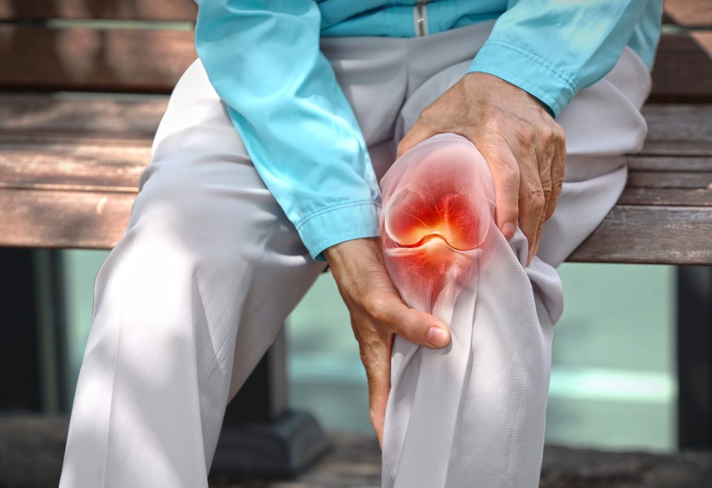 Woman with knee pain concept  