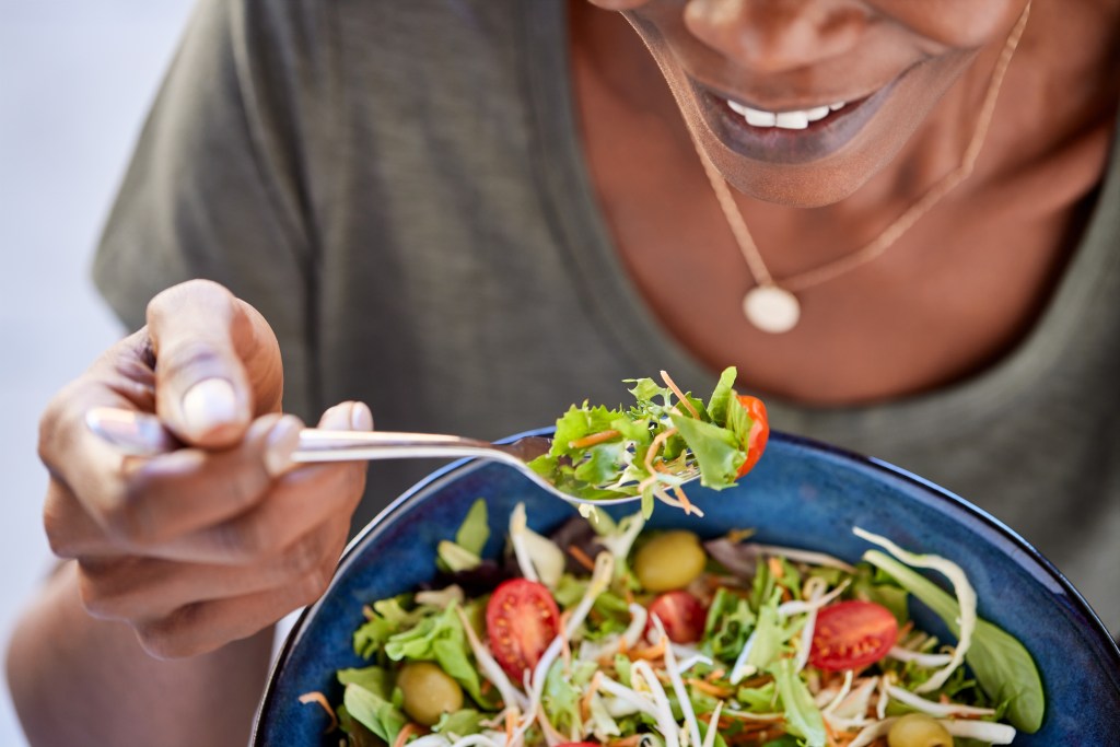 Woman eating salad
