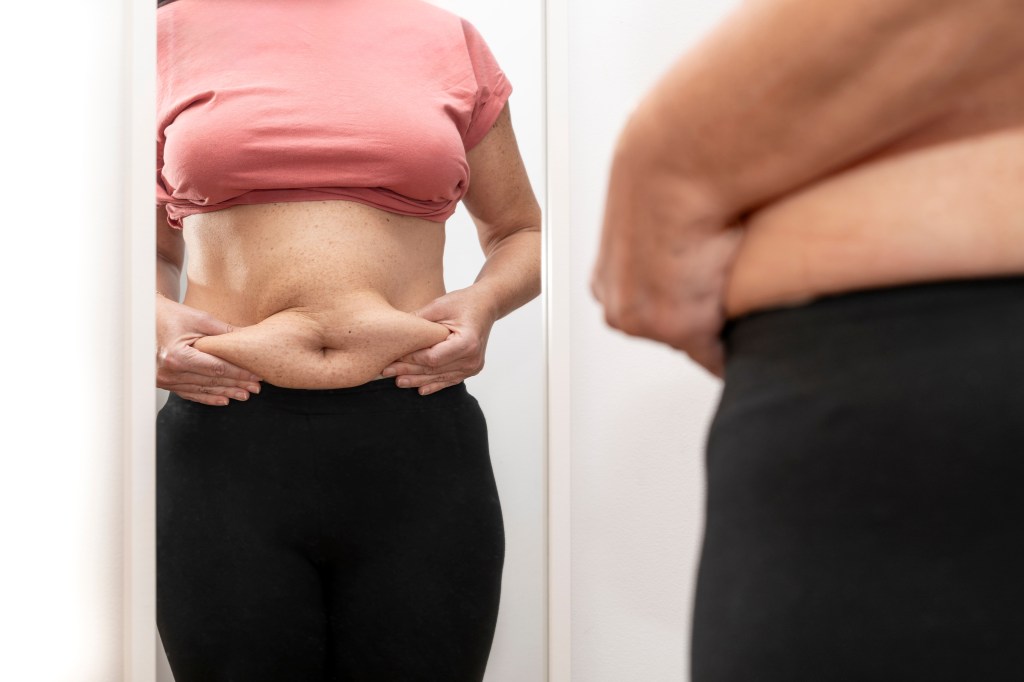 Women grabbing midsection