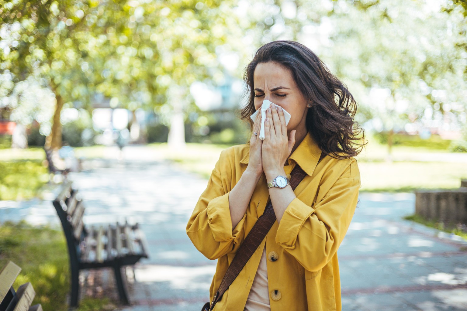 Woman blowing her nose