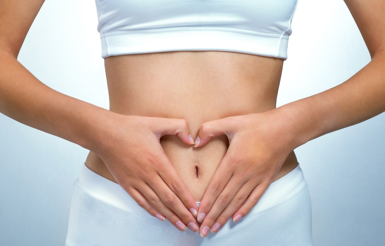 Woman with hands on stomach 