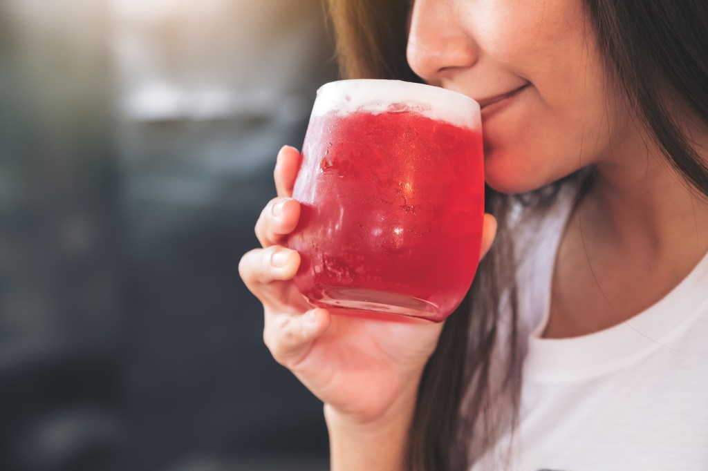 Woman drinking hibiscus tea