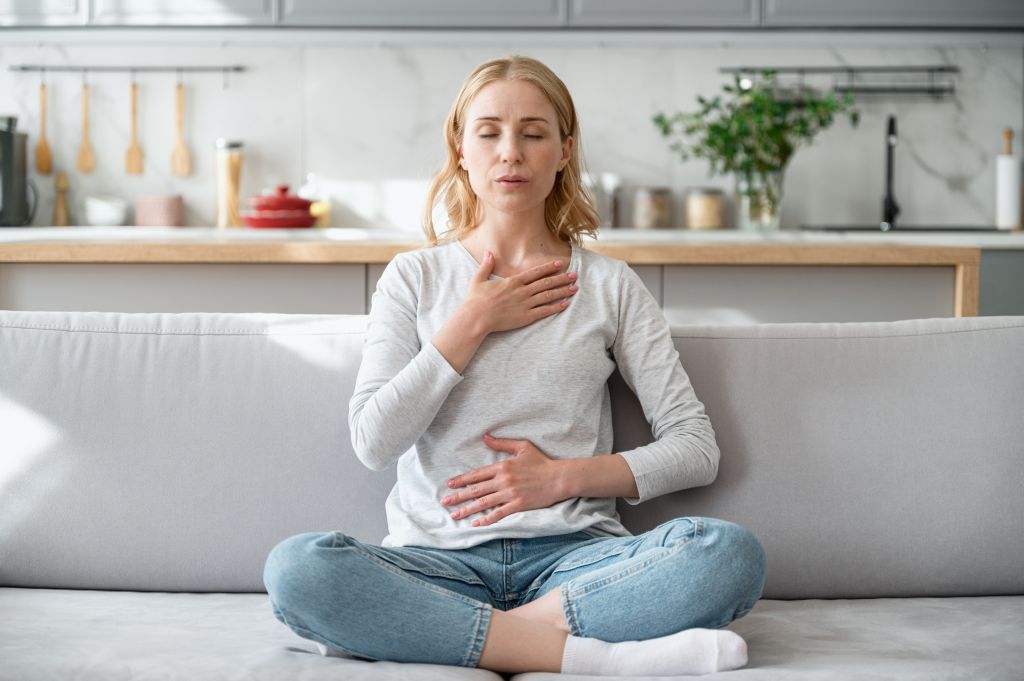 Woman practicing deep breathing   
