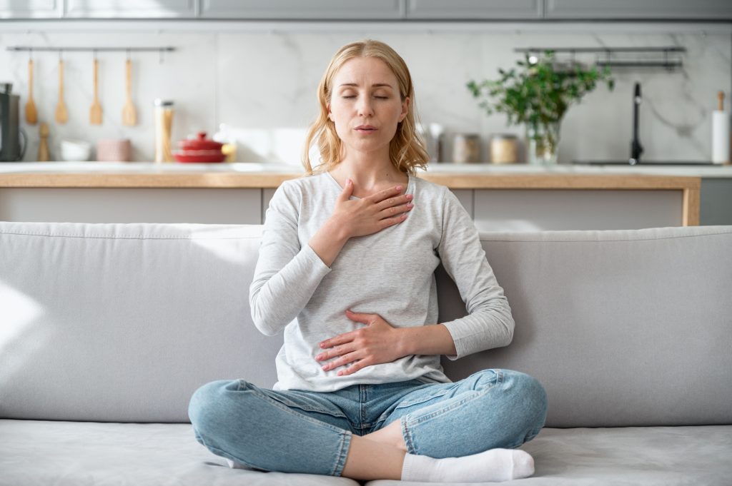 Woman practicing deep breathing