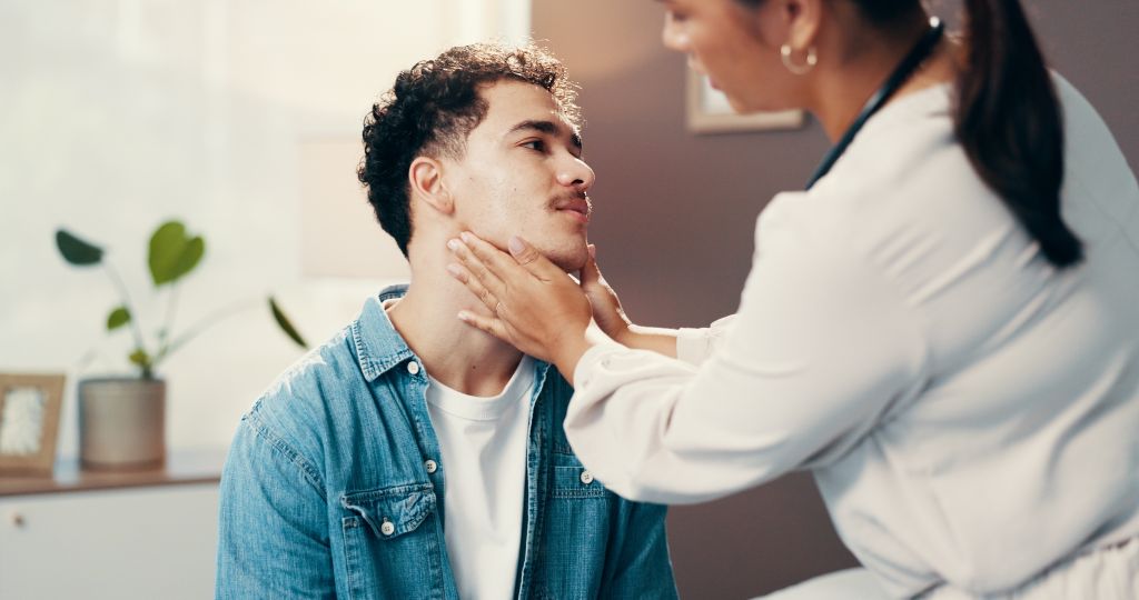 Doctor checking neck 