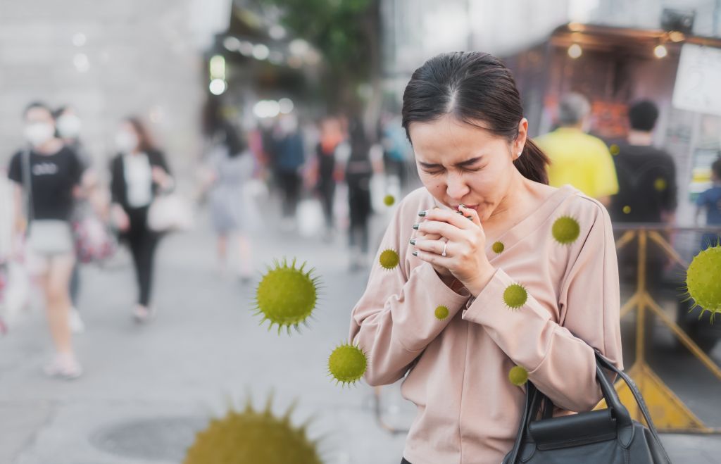 women sneezing from illness