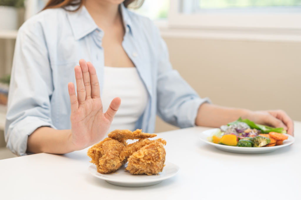 Woman refusing fried food