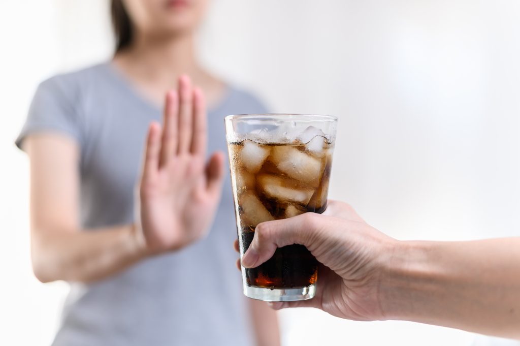 Woman refusing drink