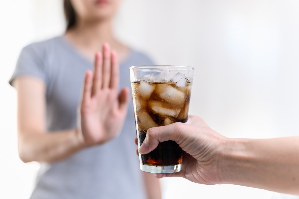 Woman refusing drink