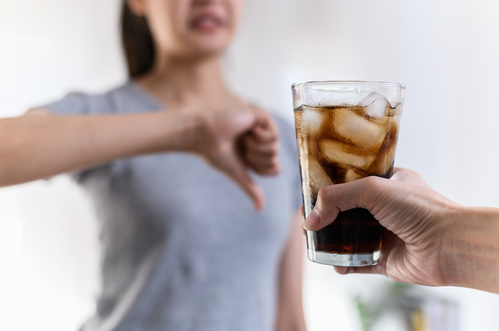 Woman rejecting coke zero sugar-free