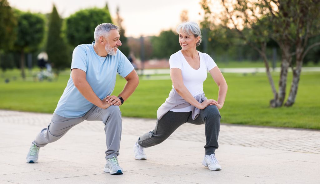 Older couple exercising outside