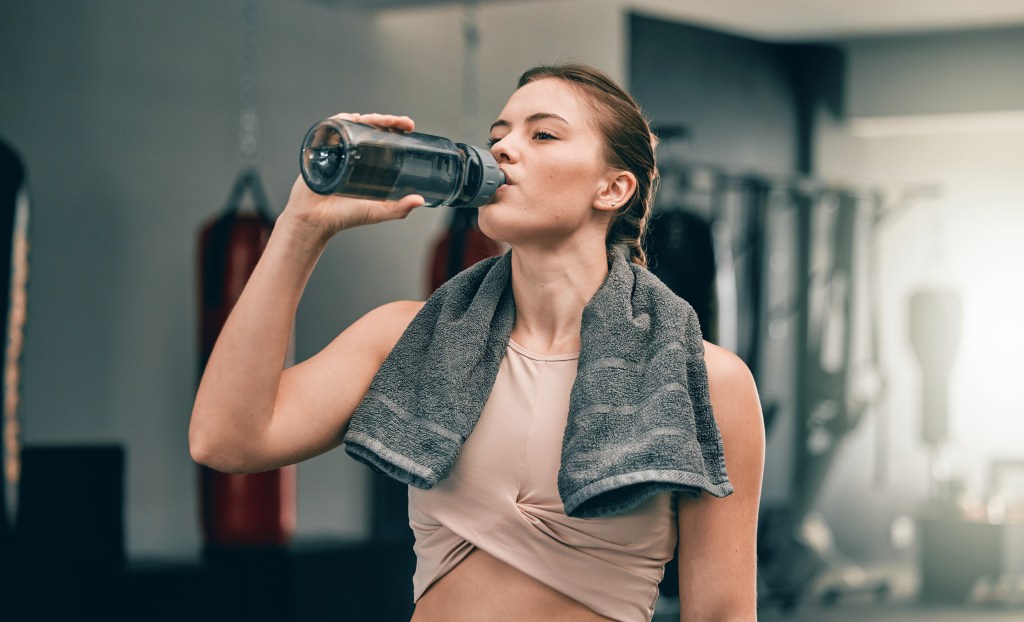 Women drinking water in gym