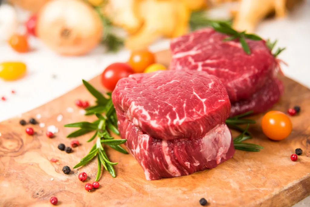 Raw steak and herbs