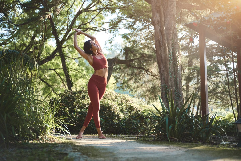 Woman standing in sunlight