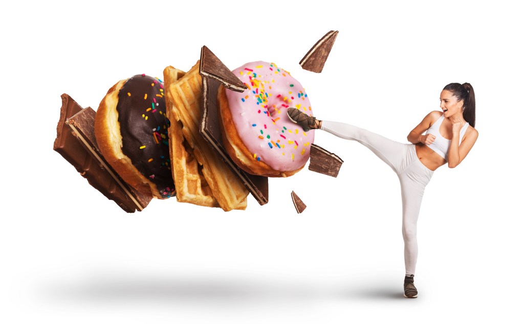Young woman kicking high-carb foods
