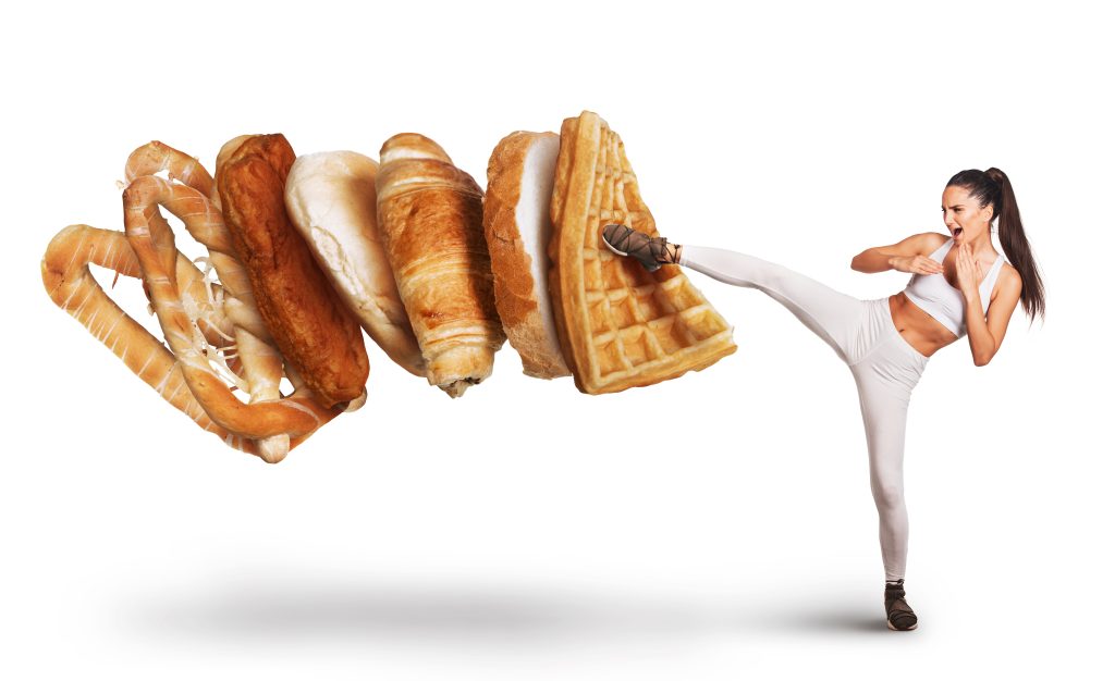 Woman kicking unhealthy foods 