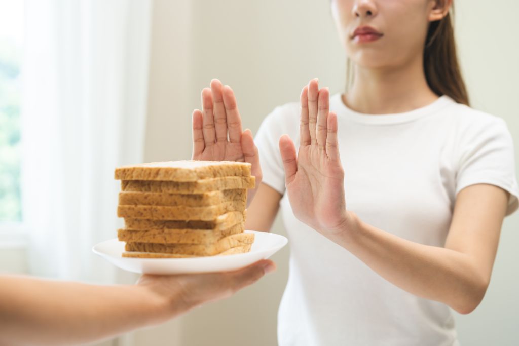 Woman saying no to bread