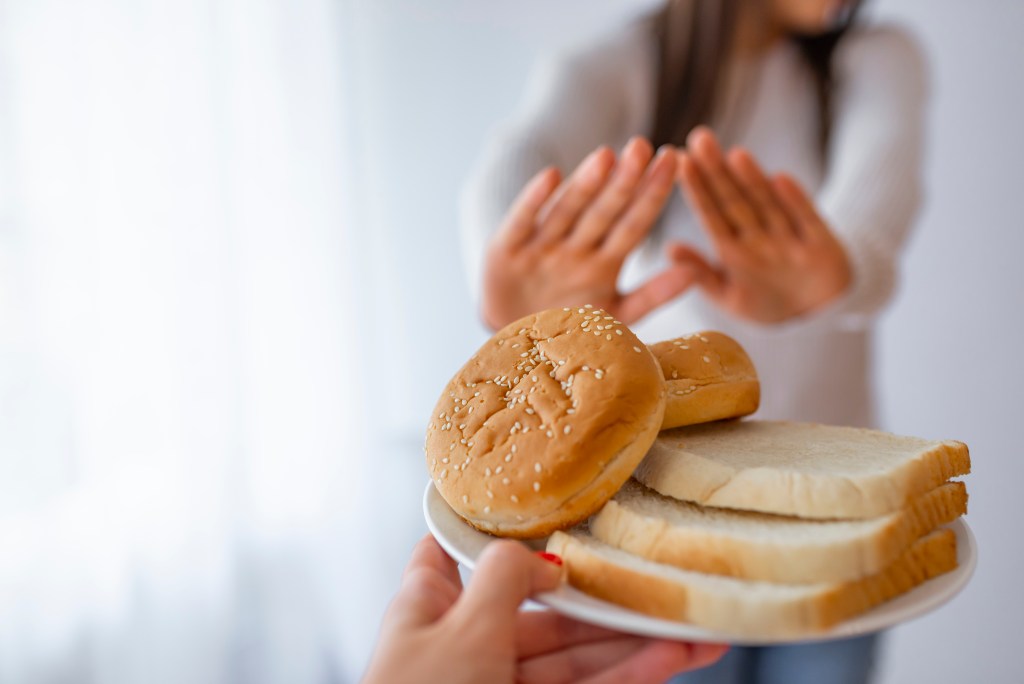 Woman declining bread