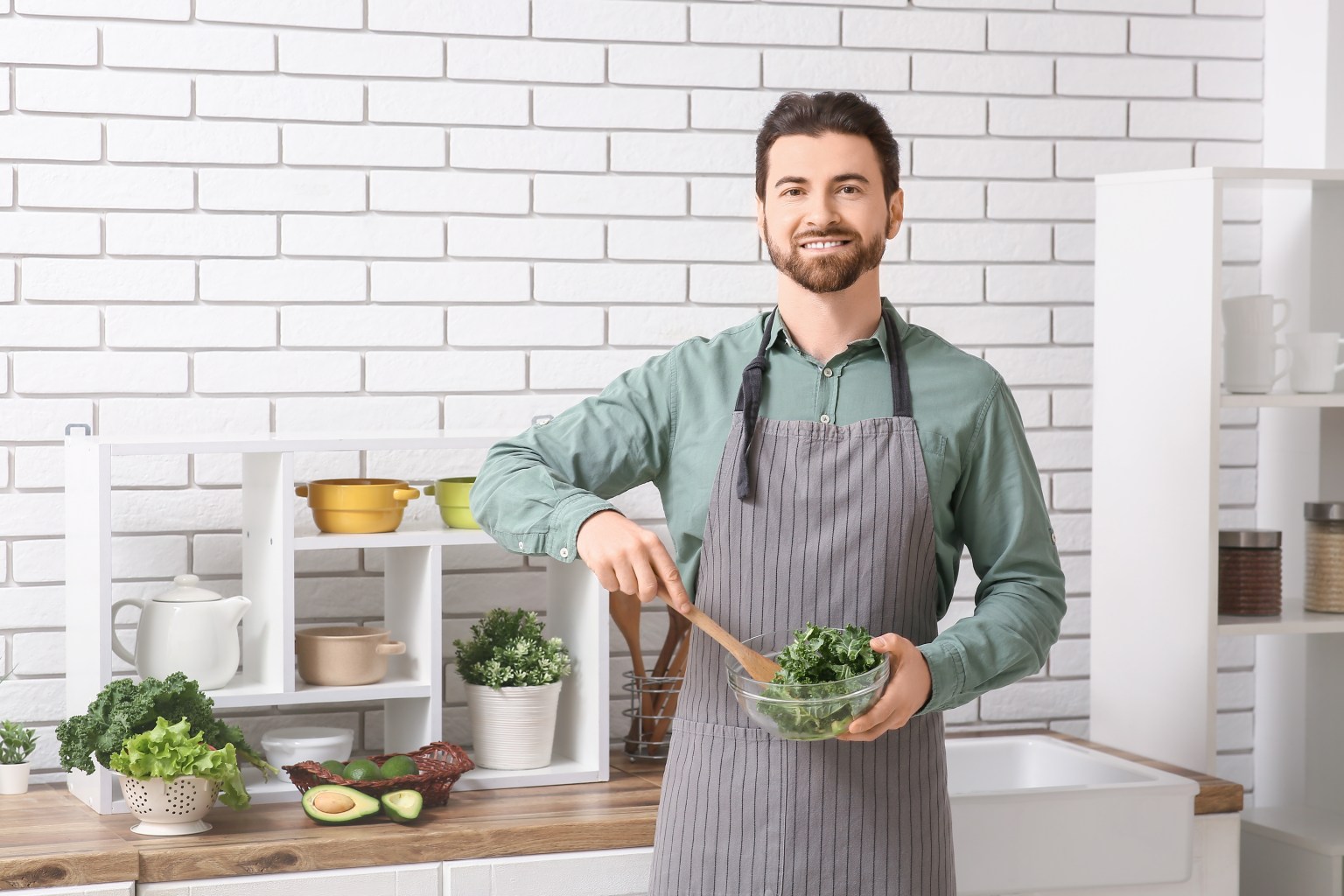 Man preparing kale salad