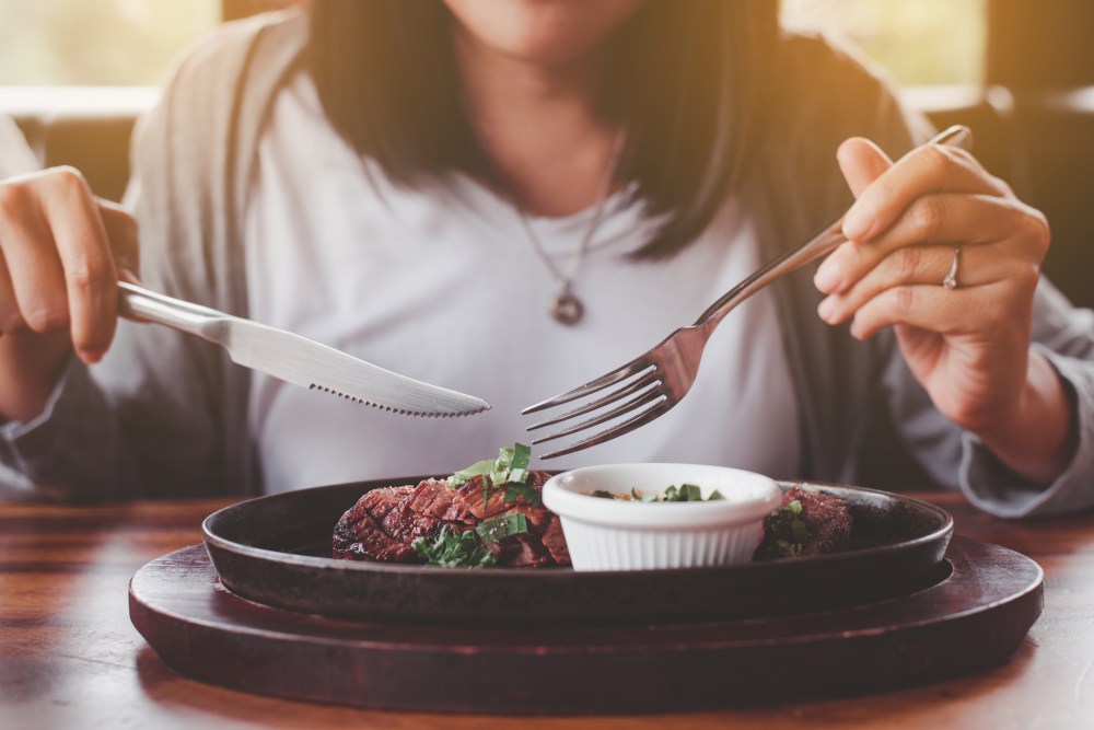 Woman enjoying steak