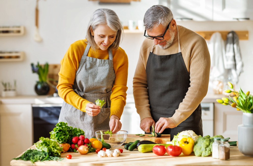 Couple prepping salad