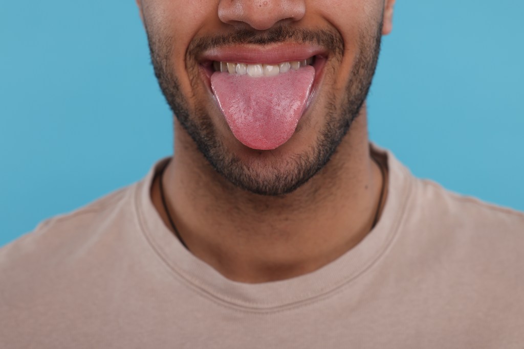 Man with tongue out
