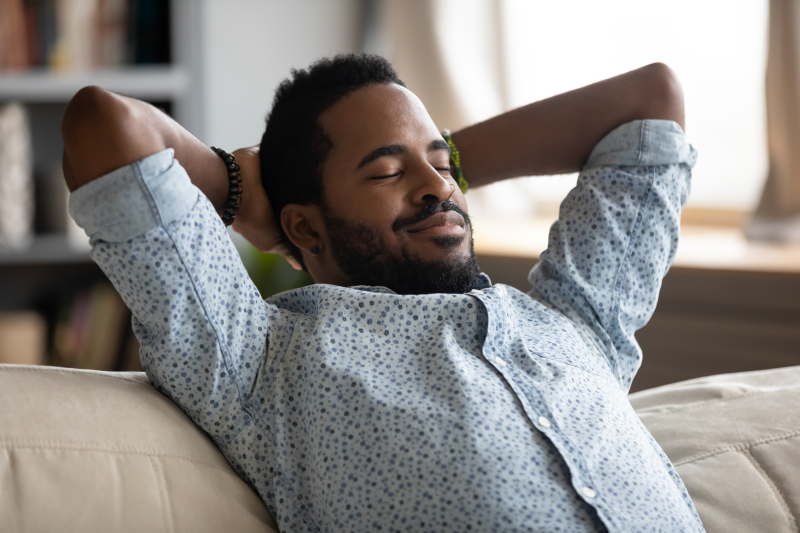 Man relaxing on a sofa