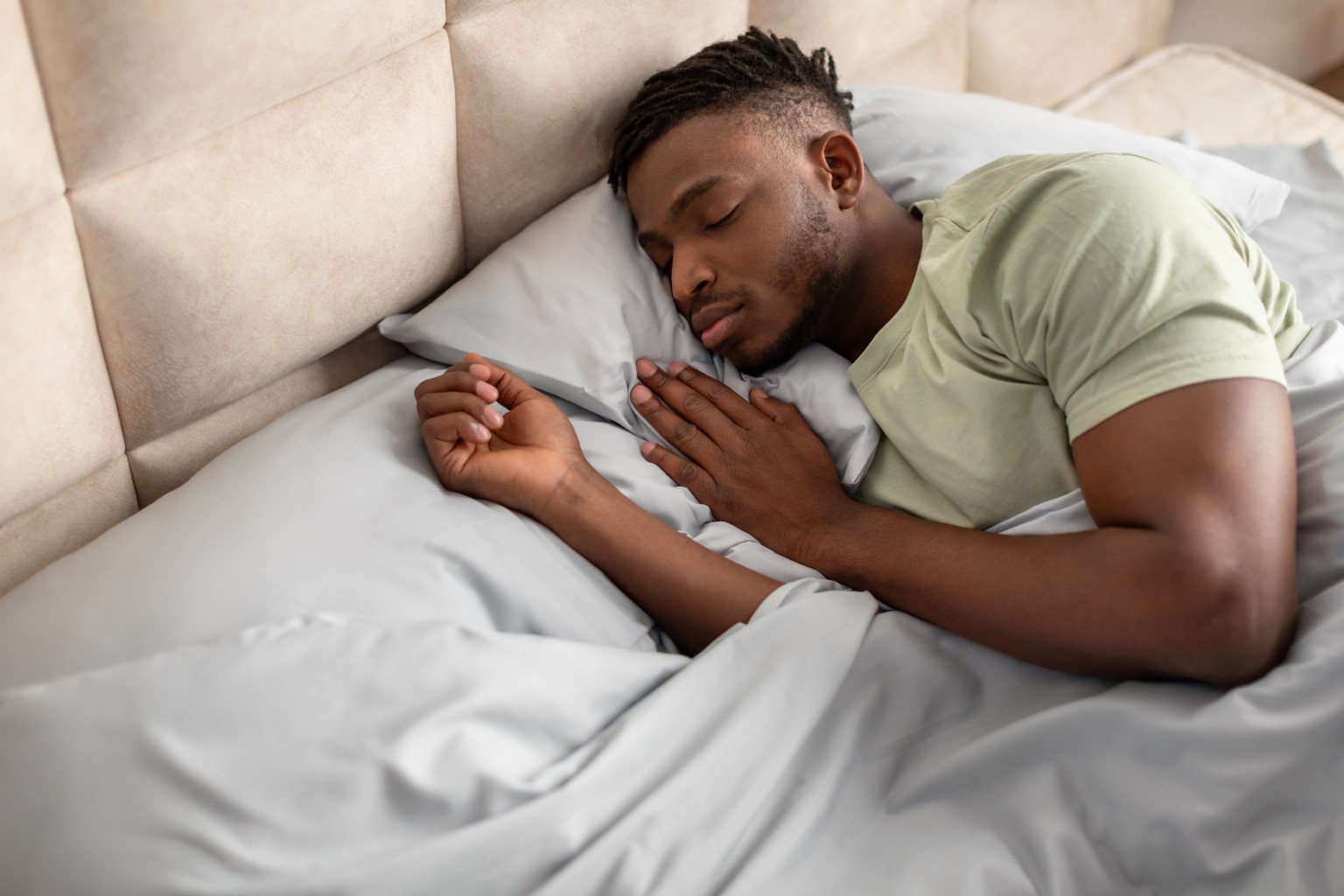 Man sleeping in a bed  