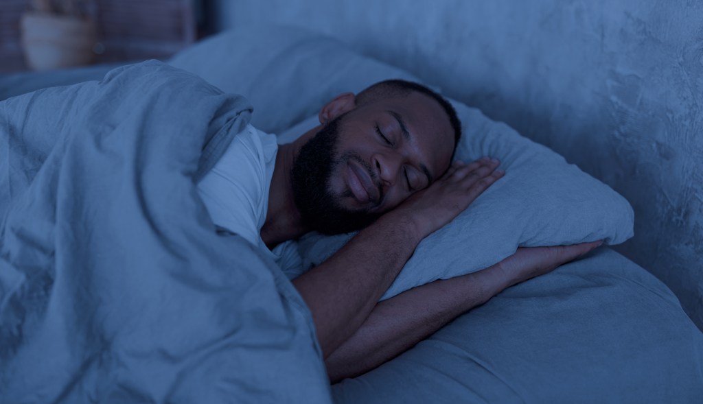 a man sleeping in bed