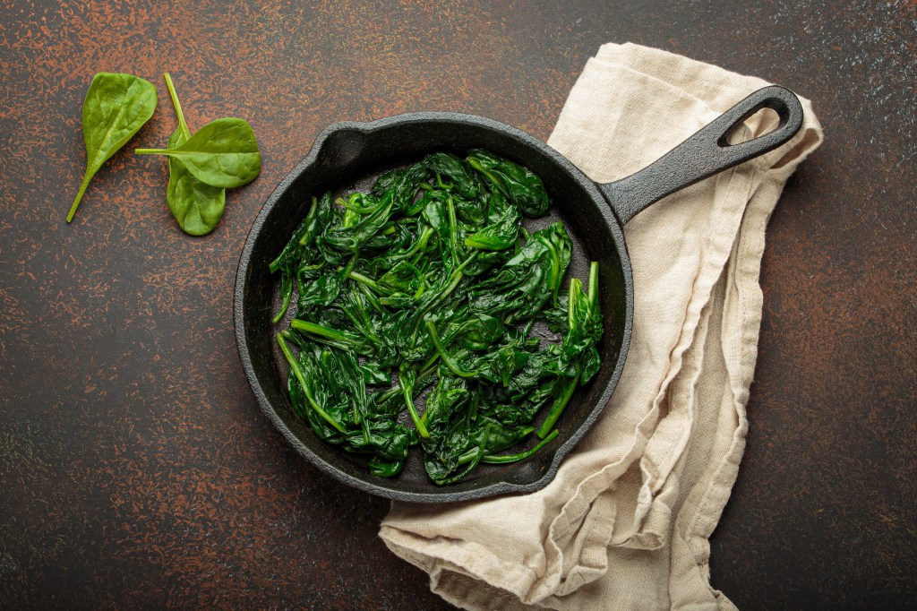 Lightly cooked spinach in a pan