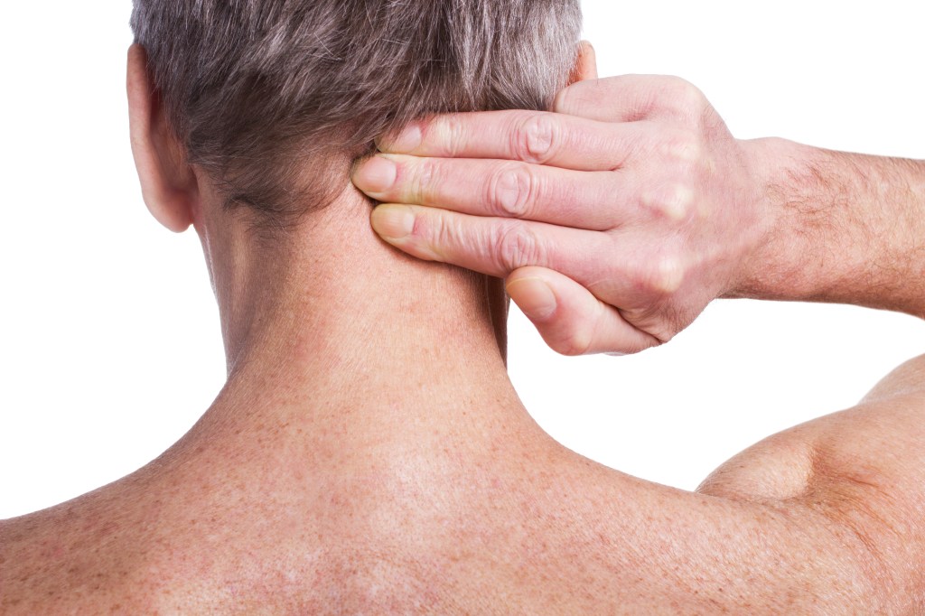 Man holding back of head