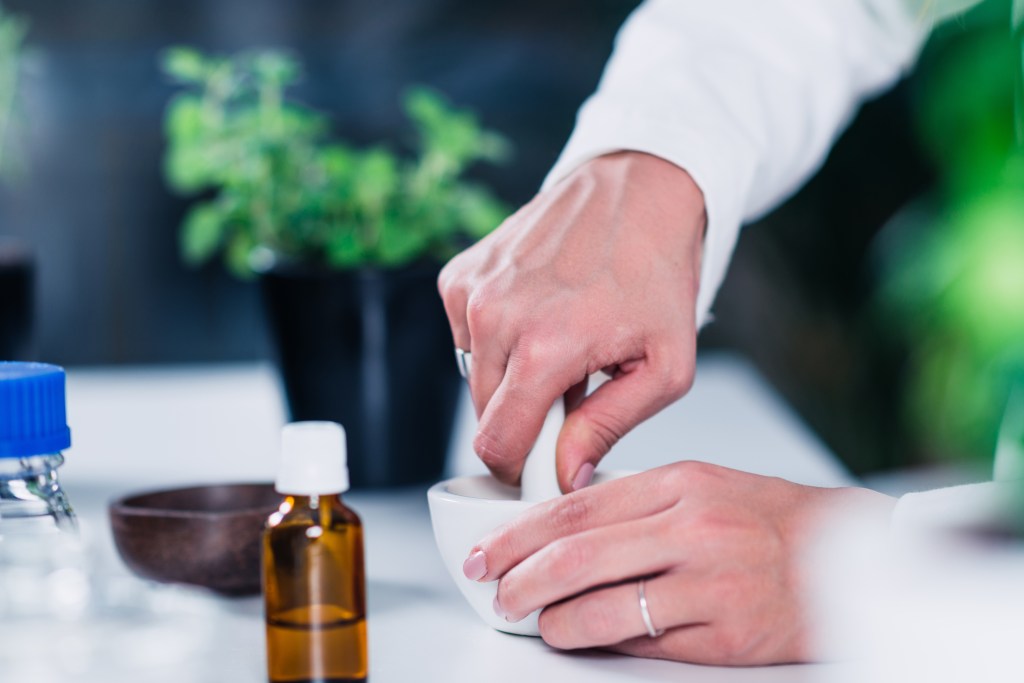 Crushing herbs with a pestle